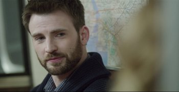 Movie still from “Before We Go” (2014), directed by Chris Evans – A person with a map in the background; Close Up shot, Over the shoulder angle