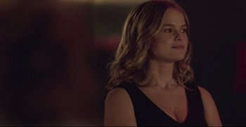 Movie still from “Before We Go” (2014), directed by Chris Evans – A beautiful woman with long blonde hair wearing a black top; Close Up shot, Over the shoulder angle