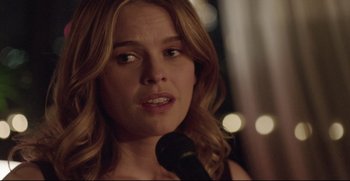 Movie still from “Before We Go” (2014), directed by Chris Evans – A person holding a microphone; Close Up shot, Over the shoulder angle