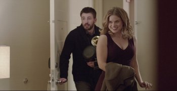 Movie still from “Before We Go” (2014), directed by Chris Evans – A man and a woman walking through a hallway; Medium shot, Over the shoulder angle