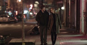 Movie still from “Before We Go” (2014), directed by Chris Evans – A man and a woman walking down a street at night; Medium shot, Low angle