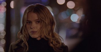 Movie still from “Before We Go” (2014), directed by Chris Evans – A beautiful young woman with long , red hair; Close Up shot, Over the shoulder angle