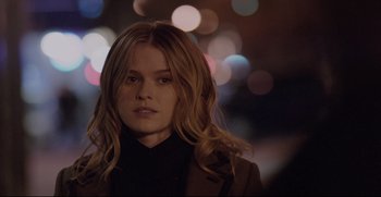 Movie still from “Before We Go” (2014), directed by Chris Evans – A beautiful young woman with long , blonde hair; Close Up shot, Over the shoulder angle