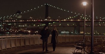 Movie still from “Before We Go” (2014), directed by Chris Evans – A man and a woman standing on the side of a road; Wide shot, Over the shoulder angle