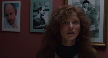 Movie still from “Being John Malkovich” (1999), directed by Spike Jonze – A person with curly red hair; Close Up shot, Low angle