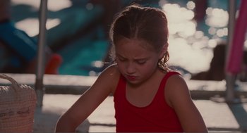 Movie still from “Being John Malkovich” (1999), directed by Spike Jonze – A little girl in a red shirt is looking down; Close Up shot, High angle