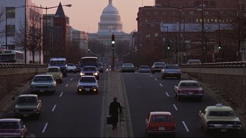 Movie still from “Being There” (1979), directed by Hal Ashby – A person is standing on the side of the road; Extreme Wide shot, Low angle