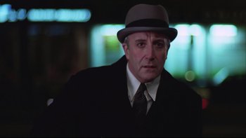 Movie still from “Being There” (1979), directed by Hal Ashby – A person wearing a suit and hat; Close Up shot, Low angle