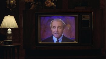 Movie still from “Being There” (1979), directed by Hal Ashby – A tv with a picture of a man on the screen; Close Up shot, Over the shoulder angle