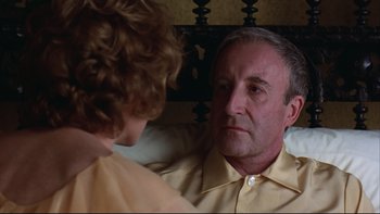 Movie still from “Being There” (1979), directed by Hal Ashby – An older man and a young woman are talking to each other; Close Up shot, Over the shoulder angle