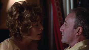 Movie still from “Being There” (1979), directed by Hal Ashby – A man and a woman looking at each other in a room; Close Up shot, Low angle