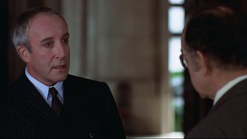 Movie still from “Being There” (1979), directed by Hal Ashby – A man and a woman talking to each other; Close Up shot, Over the shoulder angle