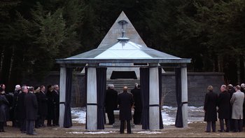 Movie still from “Being There” (1979), directed by Hal Ashby – A group of people standing around a gazebo; Wide shot, High angle