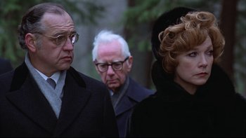 Movie still from “Being There” (1979), directed by Hal Ashby – A group of people standing next to each other; Close Up shot, Over the shoulder angle