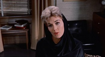 Movie still from “Bell, Book and Candle” (1976), directed by Hy Averback – A person wearing a black robe; Close Up shot, Low angle