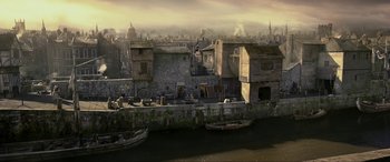 An image of an old town with a river in front of it
