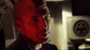 Movie still from “Below” (2002), directed by David Twohy – A person wearing a helmet; Close Up shot, Low angle