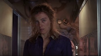 Movie still from “Below” (2002), directed by David Twohy – A person with long hair; Close Up shot, Over the shoulder angle