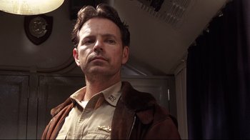 Movie still from “Below” (2002), directed by David Twohy – A person wearing a jacket; Close Up shot, Low angle