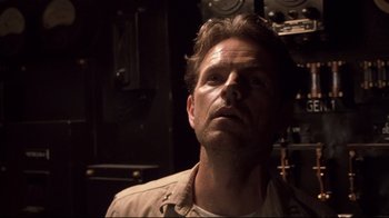 Movie still from “Below” (2002), directed by David Twohy – A person wearing a jacket; Close Up shot, Low angle