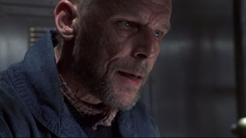 Movie still from “Below” (2002), directed by David Twohy – A person with a beard; Close Up shot, Low angle