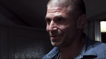 Movie still from “Below” (2002), directed by David Twohy – A person with a beard; Close Up shot, Low angle