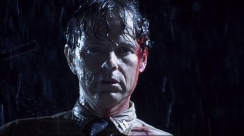 Movie still from “Below” (2002), directed by David Twohy – A person with blood on his face; Close Up shot, Low angle