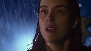 Movie still from “Below” (2002), directed by David Twohy – A woman's face in the rain; Close Up shot, Low angle