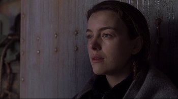 Movie still from “Below” (2002), directed by David Twohy – A person looking at the camera; Close Up shot, Low angle