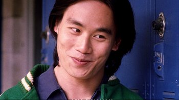 Movie still from “Better Luck Tomorrow” (2002), directed by Justin Lin – A person with long black hair; Close Up shot, Over the shoulder angle