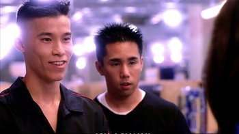 Movie still from “Better Luck Tomorrow” (2002), directed by Justin Lin – Two young men standing next to each other in a room; Close Up shot, Over the shoulder angle