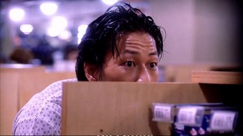 Movie still from “Better Luck Tomorrow” (2002), directed by Justin Lin – A man with wet hair sitting at a table; Close Up shot, Low angle