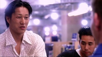 Movie still from “Better Luck Tomorrow” (2002), directed by Justin Lin – Two men sitting in a room with lights in the background; Close Up shot, Over the shoulder angle
