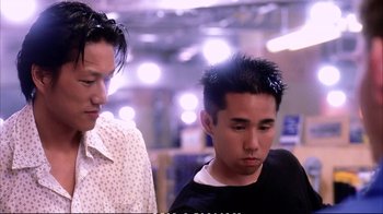 Movie still from “Better Luck Tomorrow” (2002), directed by Justin Lin – Two young men standing next to each other in a room; Close Up shot, Low angle