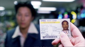 Movie still from “Better Luck Tomorrow” (2002), directed by Justin Lin – A man holding a driver's license in front of a mirror; Extreme Close Up shot, Overhead angle