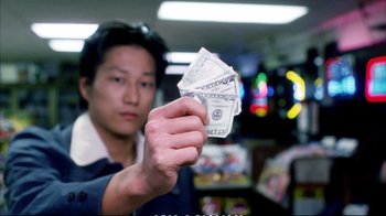 Movie still from “Better Luck Tomorrow” (2002), directed by Justin Lin – A man holding a stack of money in his hand; Close Up shot, Low angle