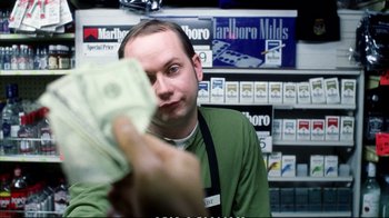 Movie still from “Better Luck Tomorrow” (2002), directed by Justin Lin – A man is holding a stack of money in his hand; Close Up shot, Over the shoulder angle