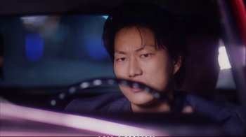 Movie still from “Better Luck Tomorrow” (2002), directed by Justin Lin – A person in a car; Close Up shot, Low angle