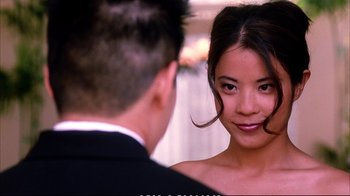 Movie still from “Better Luck Tomorrow” (2002), directed by Justin Lin – A man and a woman looking at one another in front of a mirror; Close Up shot, Over the shoulder angle