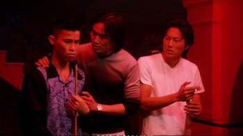 Movie still from “Better Luck Tomorrow” (2002), directed by Justin Lin – A group of men standing next to each other; Medium shot, High angle