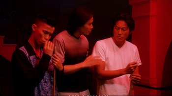 Movie still from “Better Luck Tomorrow” (2002), directed by Justin Lin – A group of young men standing next to each other; Medium shot, Over the shoulder angle