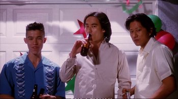 Movie still from “Better Luck Tomorrow” (2002), directed by Justin Lin – A group of men standing next to each other drinking; Medium shot, Low angle