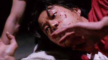Movie still from “Better Luck Tomorrow” (2002), directed by Justin Lin – A woman with blood all over her face and neck; Extreme Close Up shot, Overhead angle