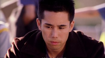 Movie still from “Better Luck Tomorrow” (2002), directed by Justin Lin – A person looking down at something; Close Up shot, High angle