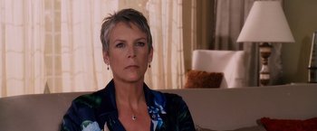 Movie still from “Beverly Hills Chihuahua” (2008), directed by Raja Gosnell – A person sitting on a couch; Close Up shot, Over the shoulder angle