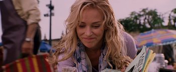 Movie still from “Beverly Hills Chihuahua” (2008), directed by Raja Gosnell – A person with long blonde curly hair; Close Up shot, Over the shoulder angle