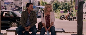 Movie still from “Beverly Hills Chihuahua” (2008), directed by Raja Gosnell – A man and a woman sitting next to each other on a bench; Medium shot, Over the shoulder angle