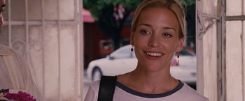 Movie still from “Beverly Hills Chihuahua” (2008), directed by Raja Gosnell – A person wearing a white and black shirt; Close Up shot, Over the shoulder angle