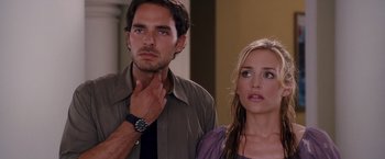 Movie still from “Beverly Hills Chihuahua” (2008), directed by Raja Gosnell – A man and a woman standing next to each other; Close Up shot, Over the shoulder angle