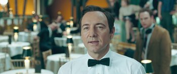 Movie still from “Beyond the Sea” (2004), directed by Kevin Spacey – A person wearing a shirt and a bow tie; Close Up shot, Over the shoulder angle